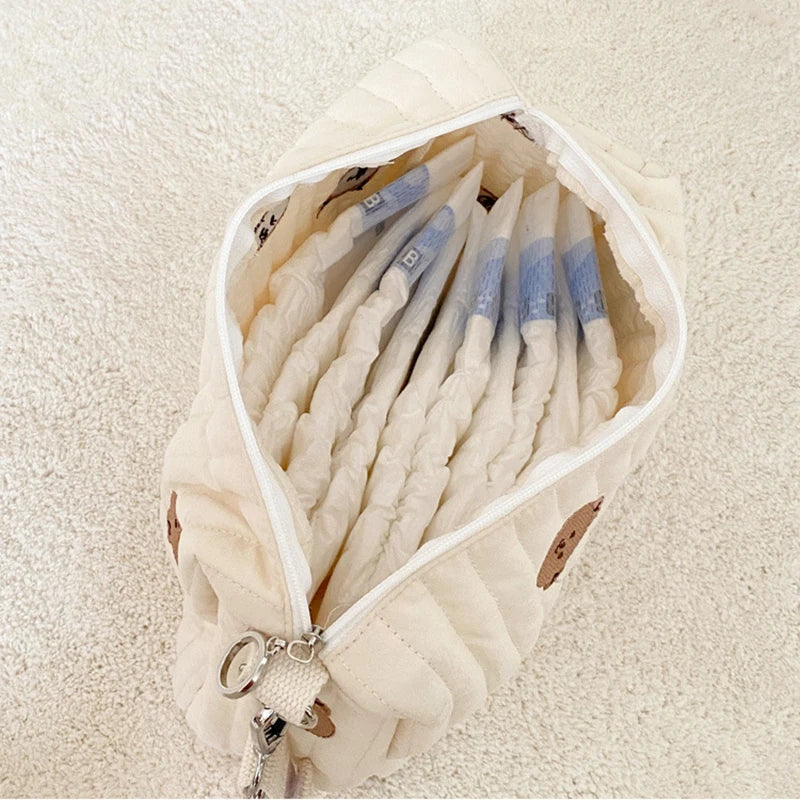 Pochette matelassée pour couches et lingettes
