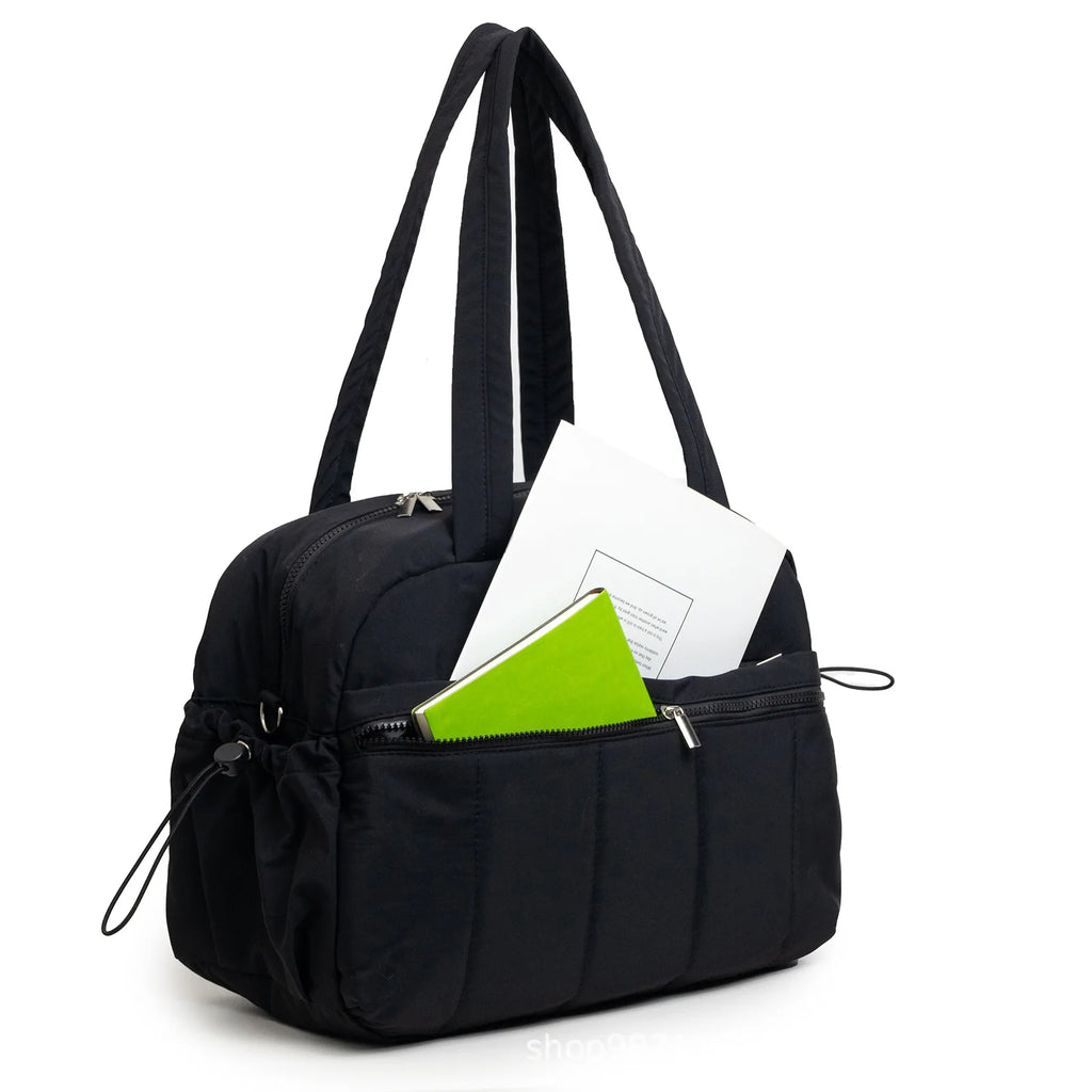 Sac à langer fourre-tout noir avec plusieurs compartiments